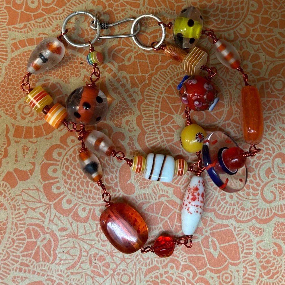 Glass Bead Bracelet with funky orange wire